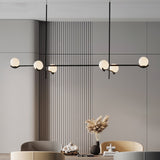 modern-metal-and-glass-globe-pendant-light-for-dining-room-in-gold-and-black-finish