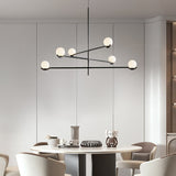 modern-metal-and-glass-globe-pendant-light-for-dining-room-in-gold-and-black-finish