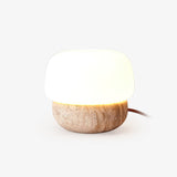 Modern Yellow Travertine Stone Table Lamp with Glass Globe for Minimalist Bedside Decor