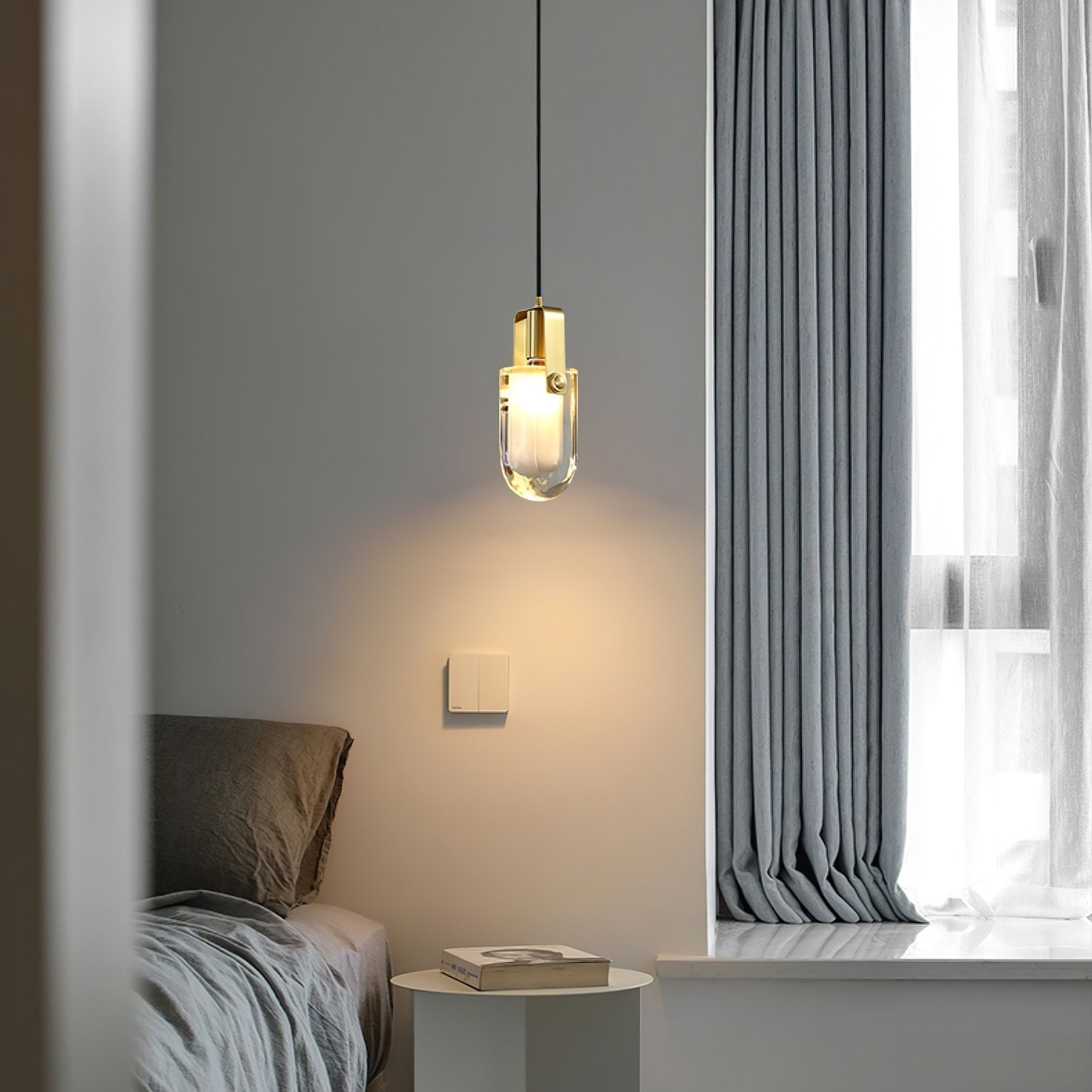 modern-oval-droplet-crystal-pendant-light-with-gold-brass-finish-for-luxury-dining-and-bedroom