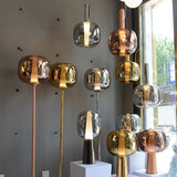 modern-dusk-dawn-blown-glass-led-pendant-light-with-geometric-conic-base