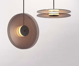 modern-eclipse-metalized-glass-disc-pendant-lamp-with-brass-details-and-soft-integrated-led-lighting