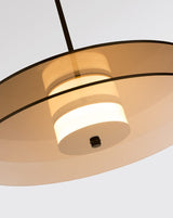 modern-eclipse-metalized-glass-disc-pendant-lamp-with-brass-details-and-soft-integrated-led-lighting