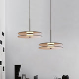 modern-eclipse-metalized-glass-disc-pendant-lamp-with-brass-details-and-soft-integrated-led-lighting