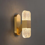 modern-luxury-oval-glass-wall-sconce-with-textured-ice-glass-and-brass-finish-integrated-led-lighting