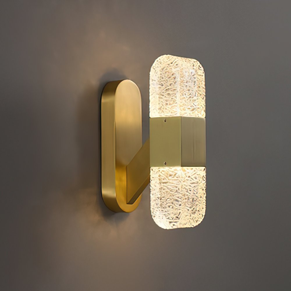 modern-luxury-oval-glass-wall-sconce-with-textured-ice-glass-and-brass-finish-integrated-led-lighting