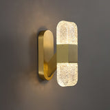 modern-luxury-oval-glass-wall-sconce-with-textured-ice-glass-and-brass-finish-integrated-led-lighting