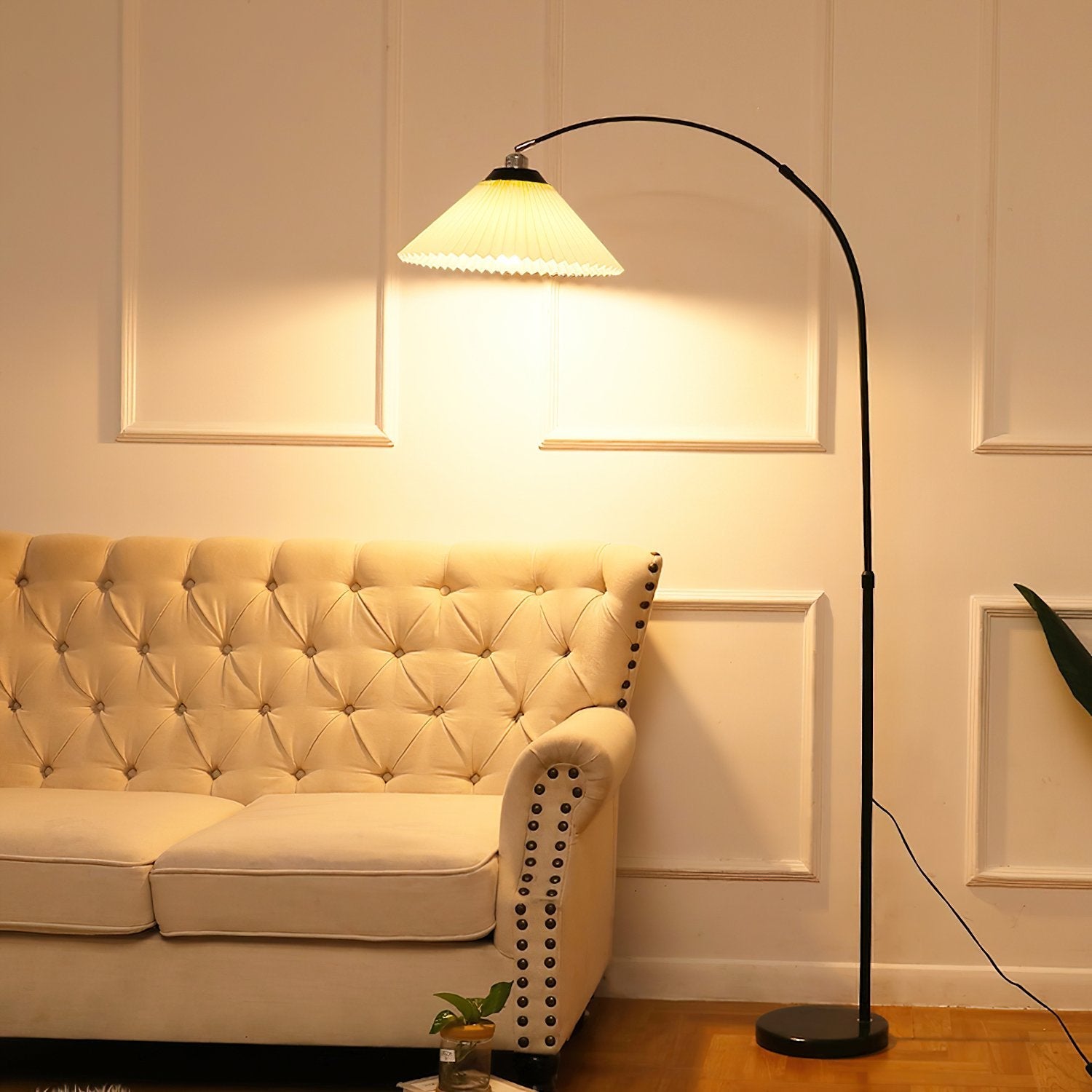 modern-arched-floor-lamp-with-pleated-white-shade-and-matte-black-metal-frame