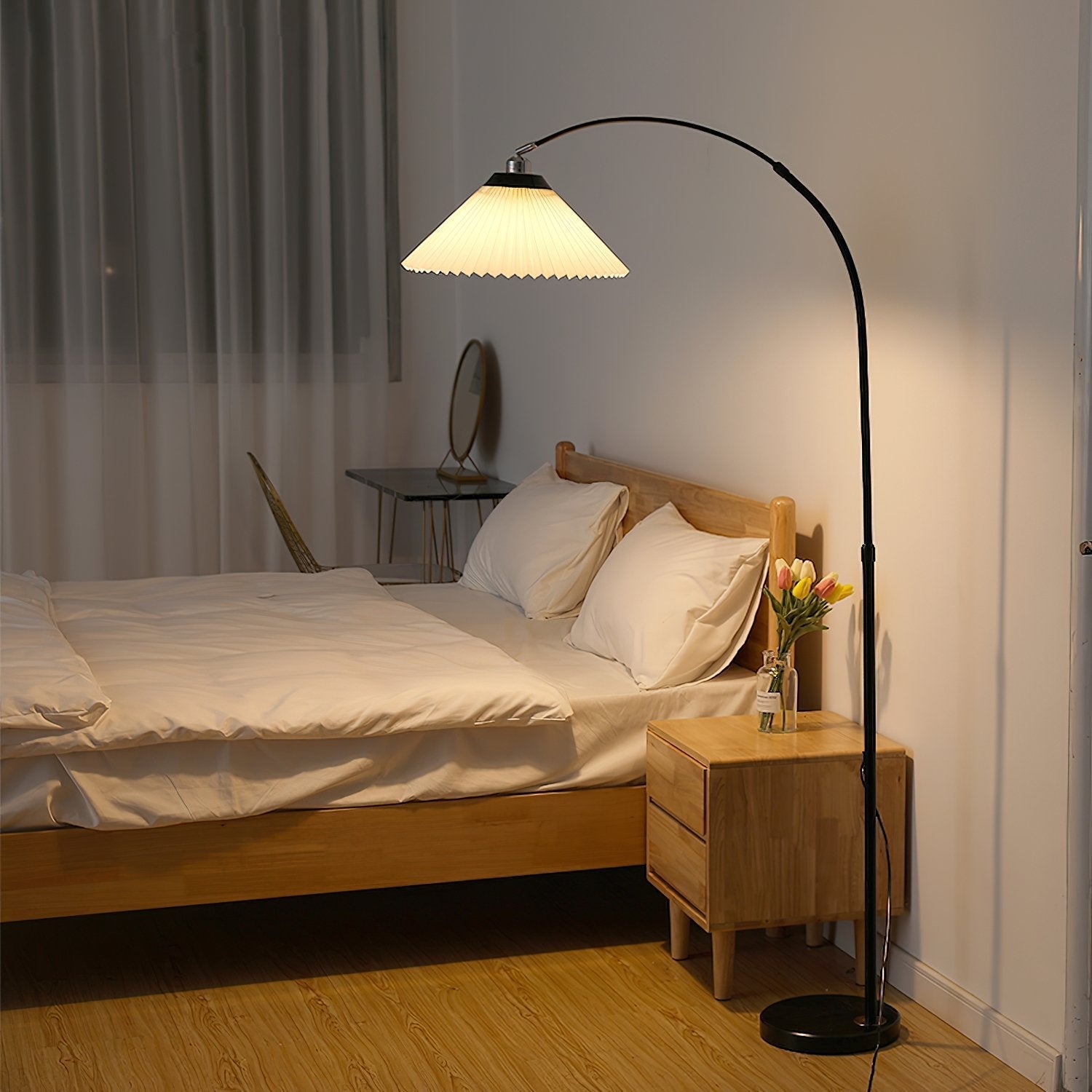 modern-arched-floor-lamp-with-pleated-white-shade-and-matte-black-metal-frame
