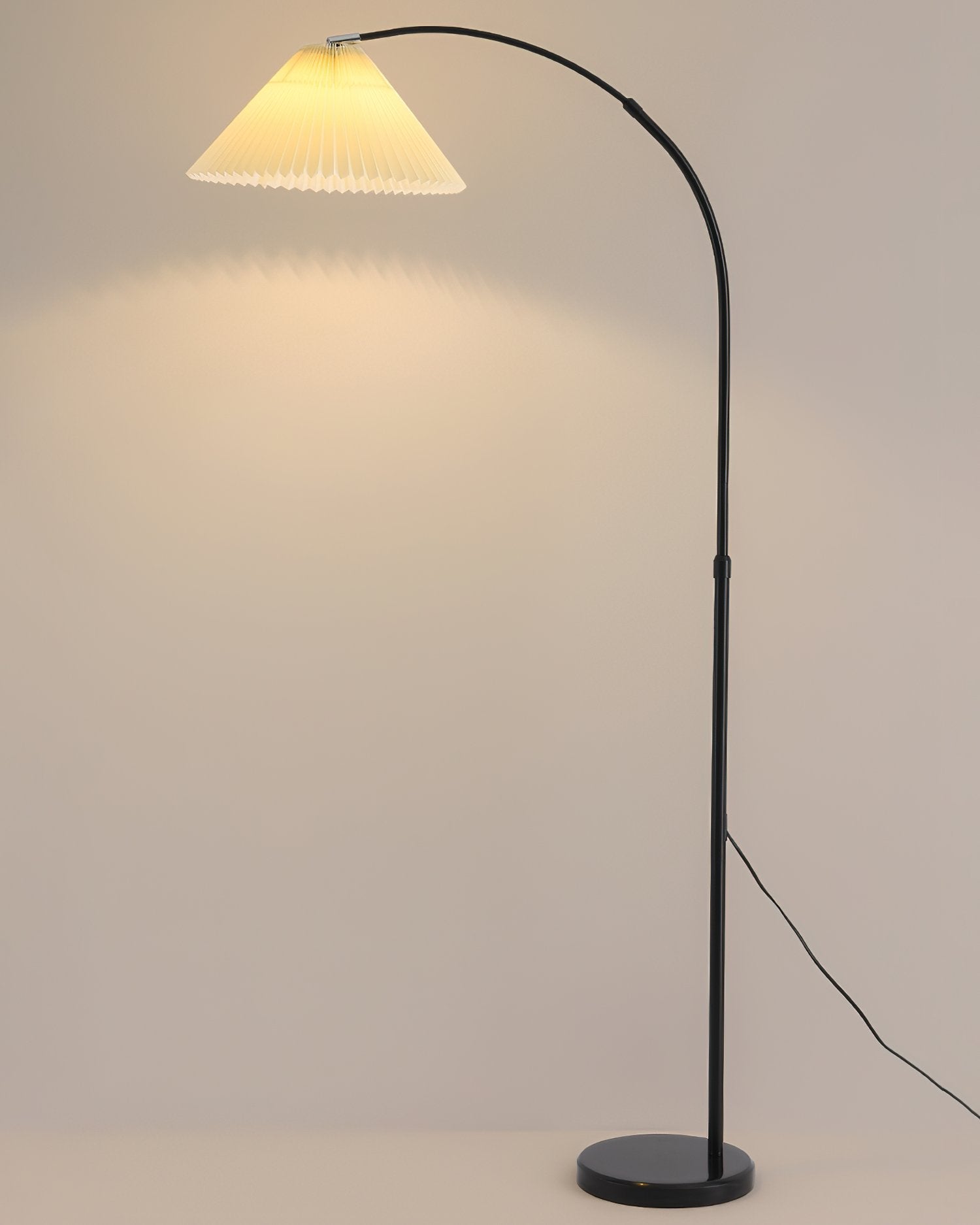 modern-arched-floor-lamp-with-pleated-white-shade-and-matte-black-metal-frame