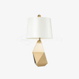 modern-gold-asymmetrical-faceted-table-lamp-with-polyhedral-metal-base-and-fabric-shade