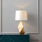modern-gold-asymmetrical-faceted-table-lamp-with-polyhedral-metal-base-and-fabric-shade