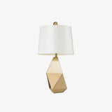 modern-gold-asymmetrical-faceted-table-lamp-with-polyhedral-metal-base-and-fabric-shade