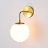 elegant-brass-fishing-wall-light-with-white-glass-globe-shade-for-indoor-decor