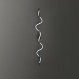 modern-spiral-led-wall-sconce-with-flexible-silicone-curve-and-brass-accents