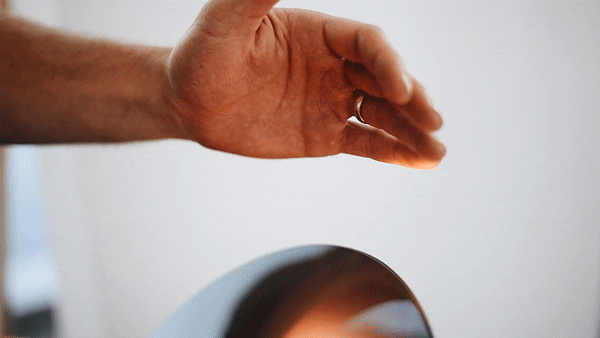 modern-interactive-glass-disc-table-lamp-with-rotating-brass-shaft-and-dimming-control