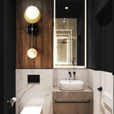 modern-geometric-composition-wall-sconce-with-gold-and-black-finish-white-glass-shade