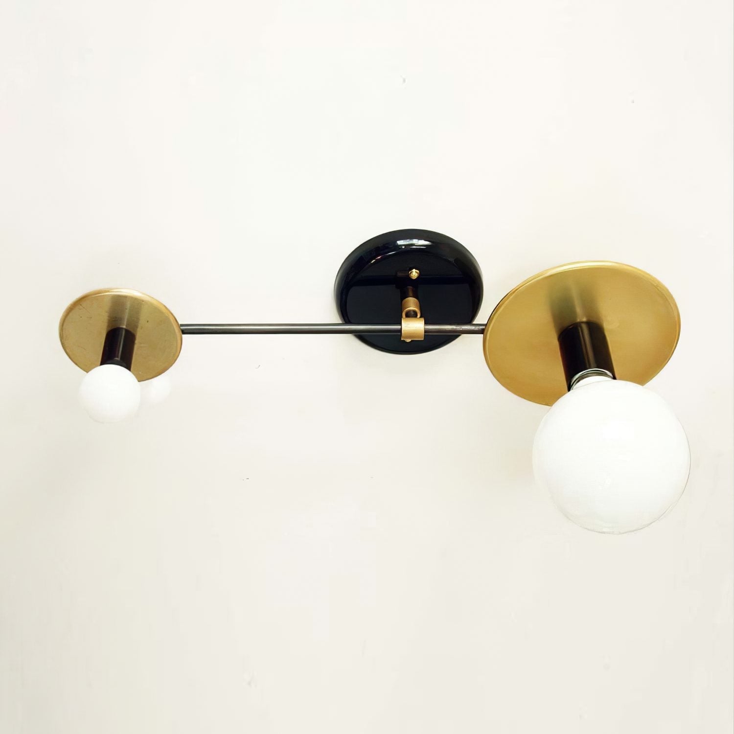 modern-geometric-composition-wall-sconce-with-gold-and-black-finish-white-glass-shade