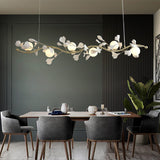 luxury-ginkgo-leaf-linear-chandelier-gold-metal-bar-light-with-white-ceramic-petal-shades