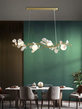 luxury-ginkgo-leaf-linear-chandelier-gold-metal-bar-light-with-white-ceramic-petal-shades