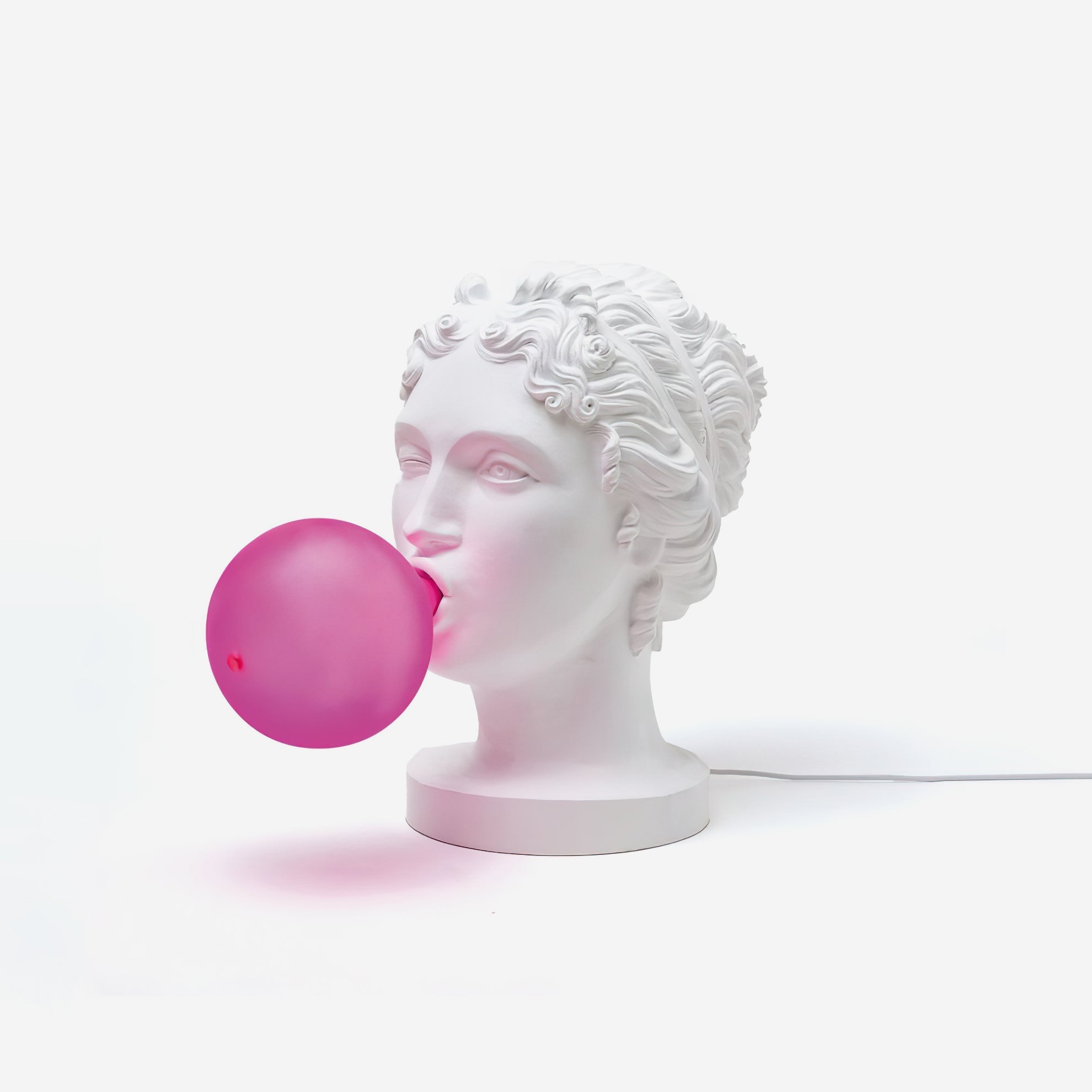 Modern Grace Portable Table Lamp with Pink Glass Globe and White Resin Bust Sculptural Base