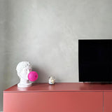Modern Grace Portable Table Lamp with Pink Glass Globe and White Resin Bust Sculptural Base