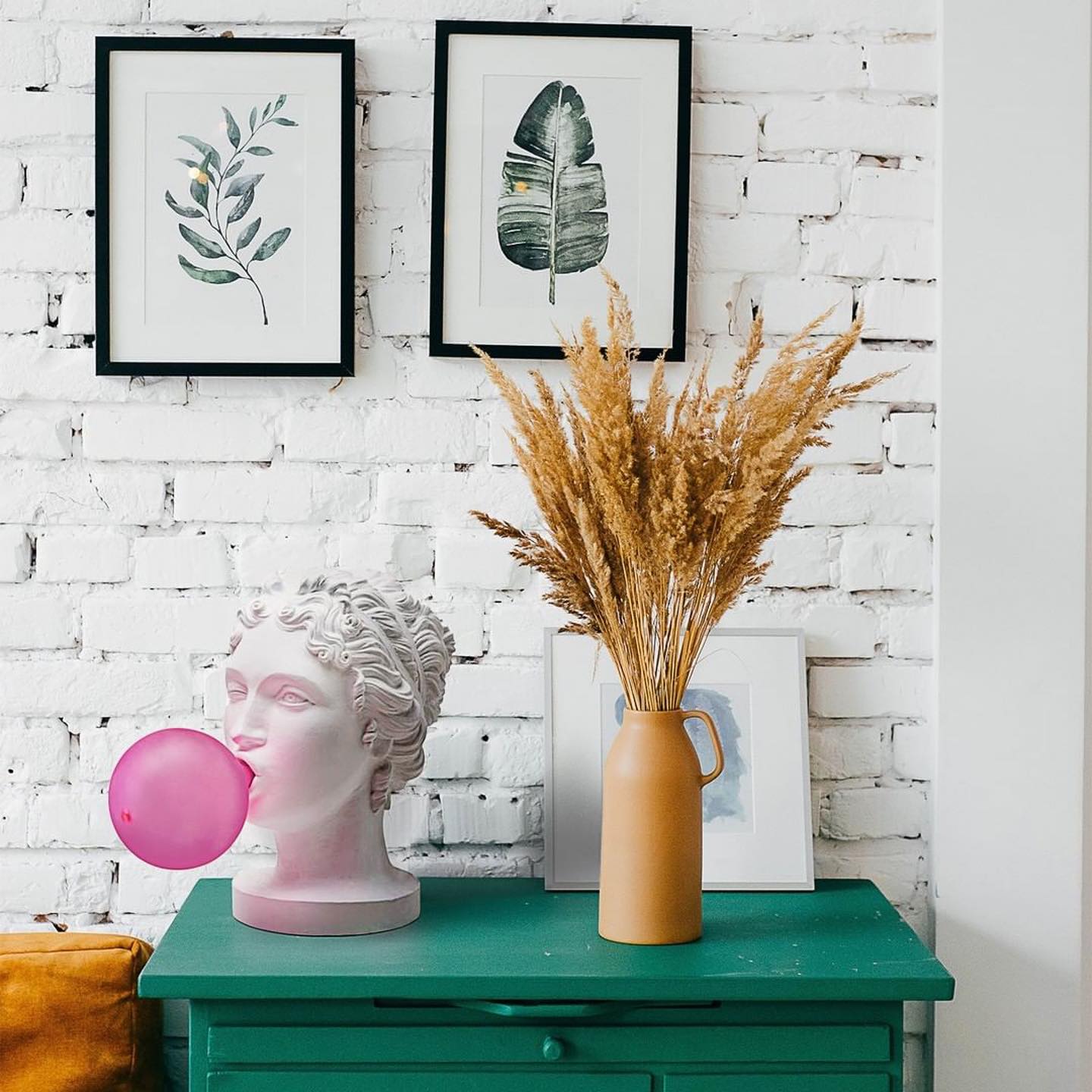 Modern Grace Portable Table Lamp with Pink Glass Globe and White Resin Bust Sculptural Base