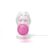 Modern Grace Portable Table Lamp with Pink Glass Globe and White Resin Bust Sculptural Base