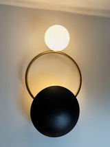 modern-geometric-circle-design-wall-sconce-gold-and-black-indoor-accent-lighting