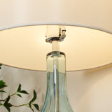 Modern Azure Blue Glass Table Lamp with Crystal Accents and Beige Linen Drum Shade