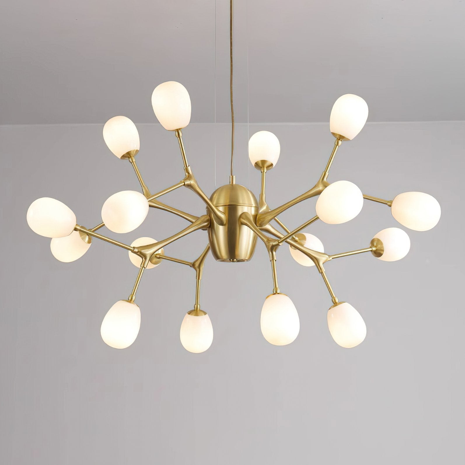 modern-brass-chandelier-with-pearl-glass-shades-and-elegant-curved-arms
