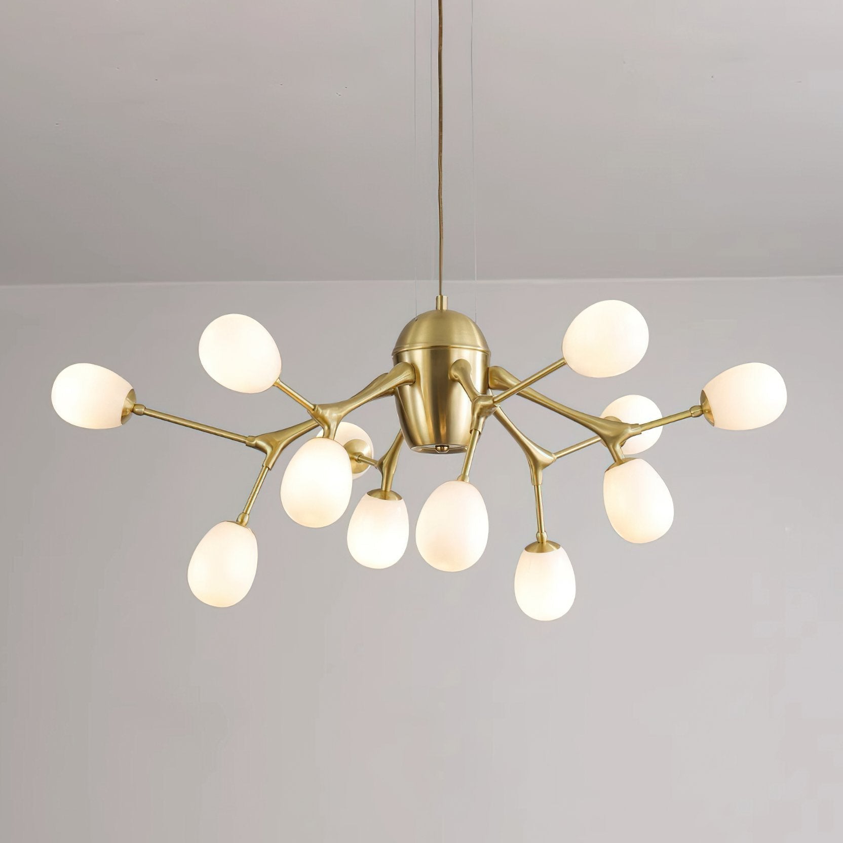 modern-brass-chandelier-with-pearl-glass-shades-and-elegant-curved-arms