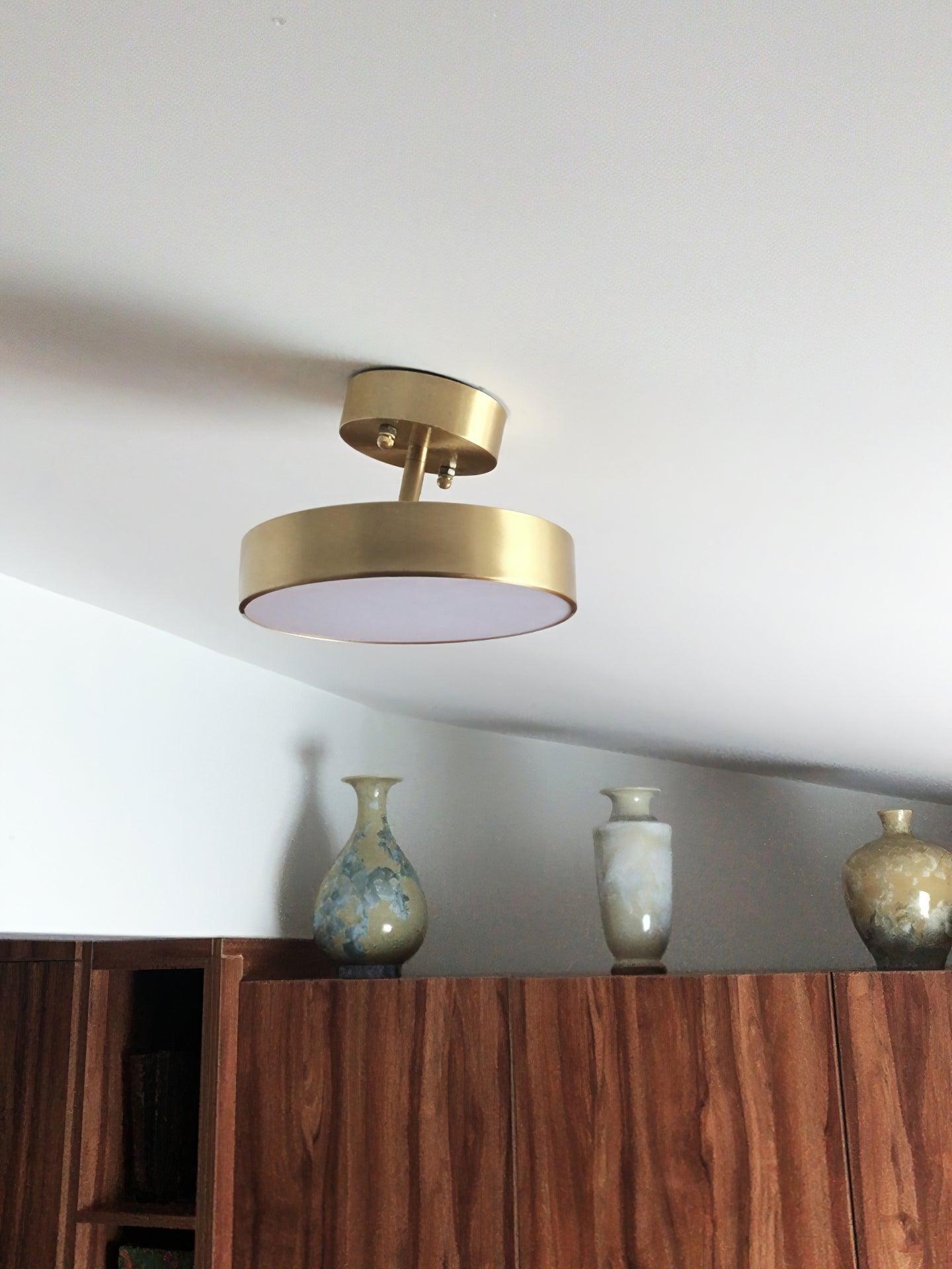 Modern Minimalist Hero Rotating LED Ceiling Light with Brass Finish and Adjustable Illumination