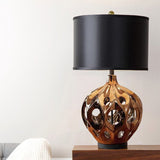 modern-ceramic-table-lamp-with-hollow-design-and-fabric-drum-shade-for-elegant-interior-lighting-decor