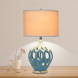 modern-ceramic-table-lamp-with-hollow-design-and-fabric-drum-shade-for-elegant-interior-lighting-decor