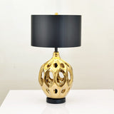 modern-ceramic-table-lamp-with-hollow-design-and-fabric-drum-shade-for-elegant-interior-lighting-decor