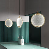 modern-circular-glass-pendant-light-with-brass-finish-and-integrated-led-spotlight