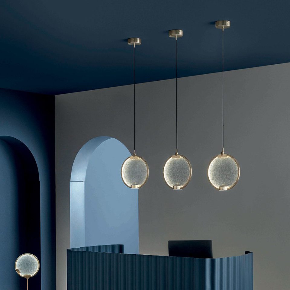 modern-circular-glass-pendant-light-with-brass-finish-and-integrated-led-spotlight