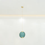 modern-circular-glass-pendant-light-with-brass-finish-and-integrated-led-spotlight