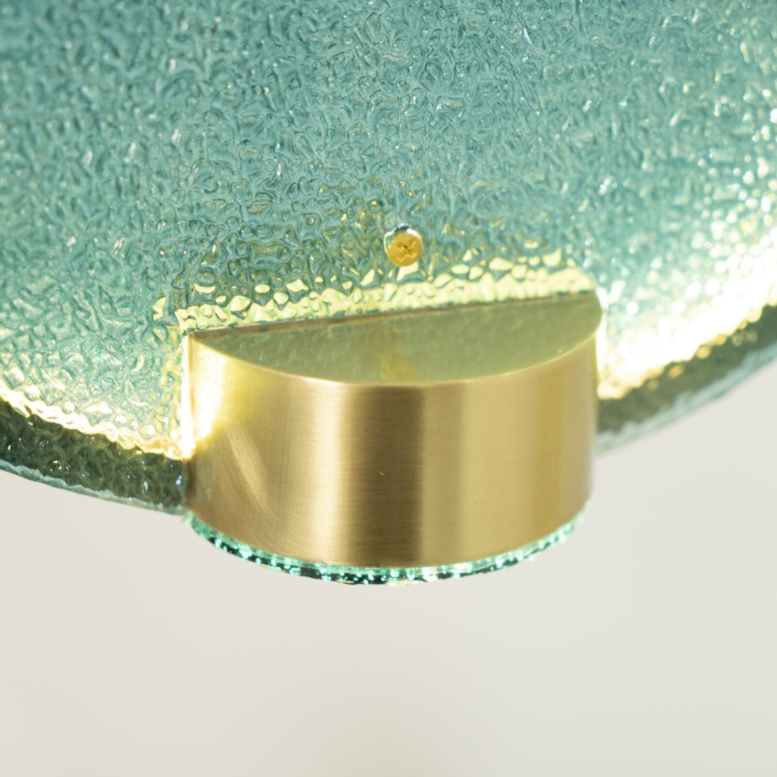 modern-circular-glass-pendant-light-with-brass-finish-and-integrated-led-spotlight