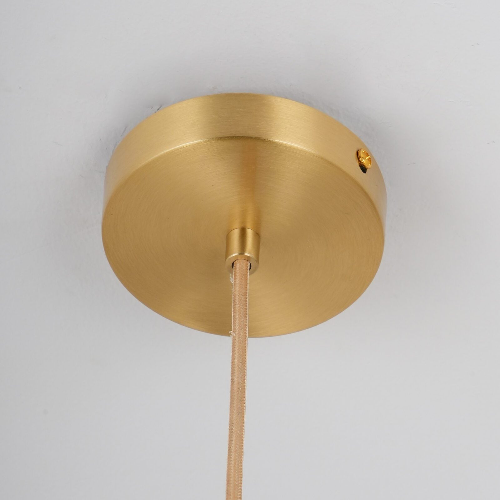modern-circular-glass-pendant-light-with-brass-finish-and-integrated-led-spotlight