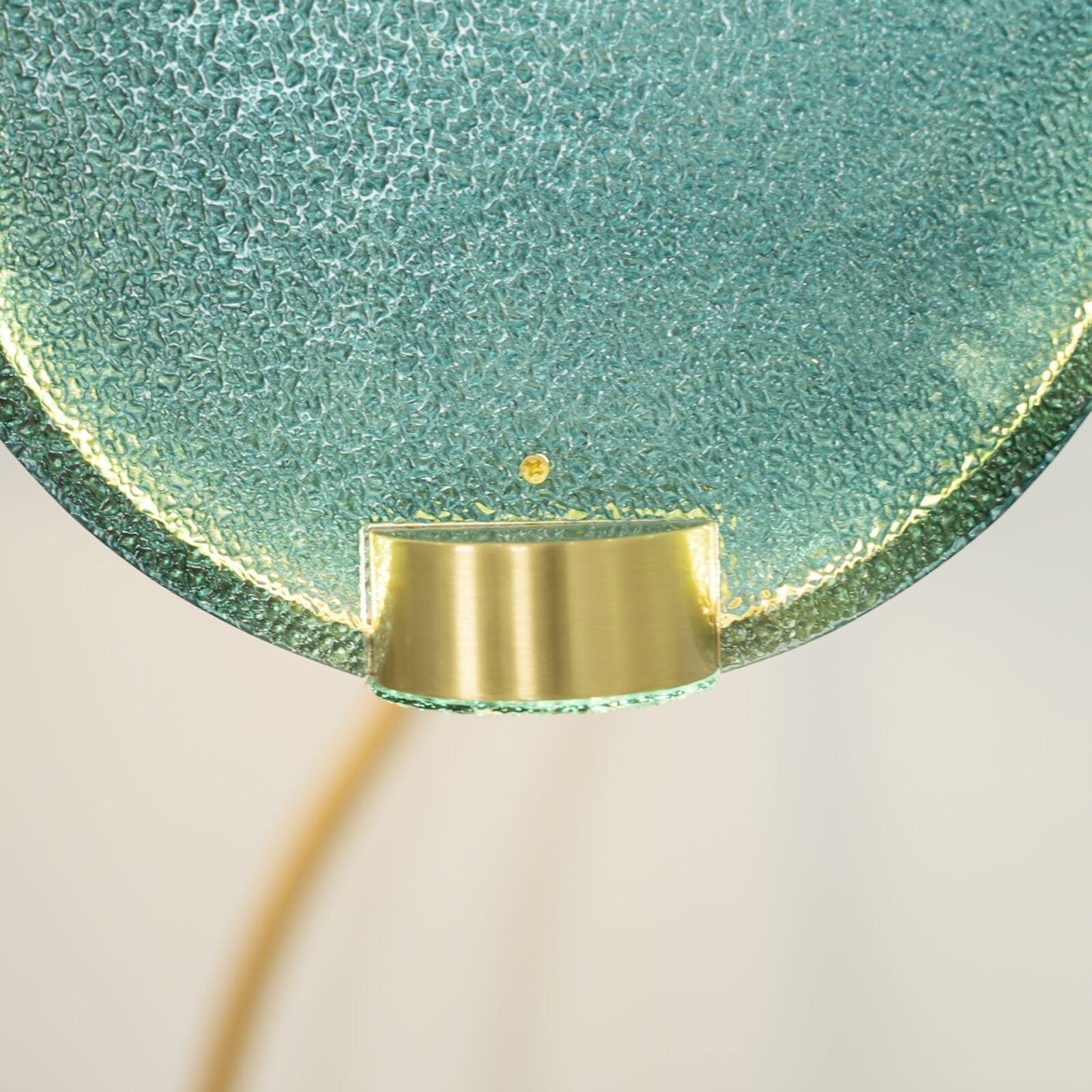 modern-circular-glass-pendant-light-with-brass-finish-and-integrated-led-spotlight