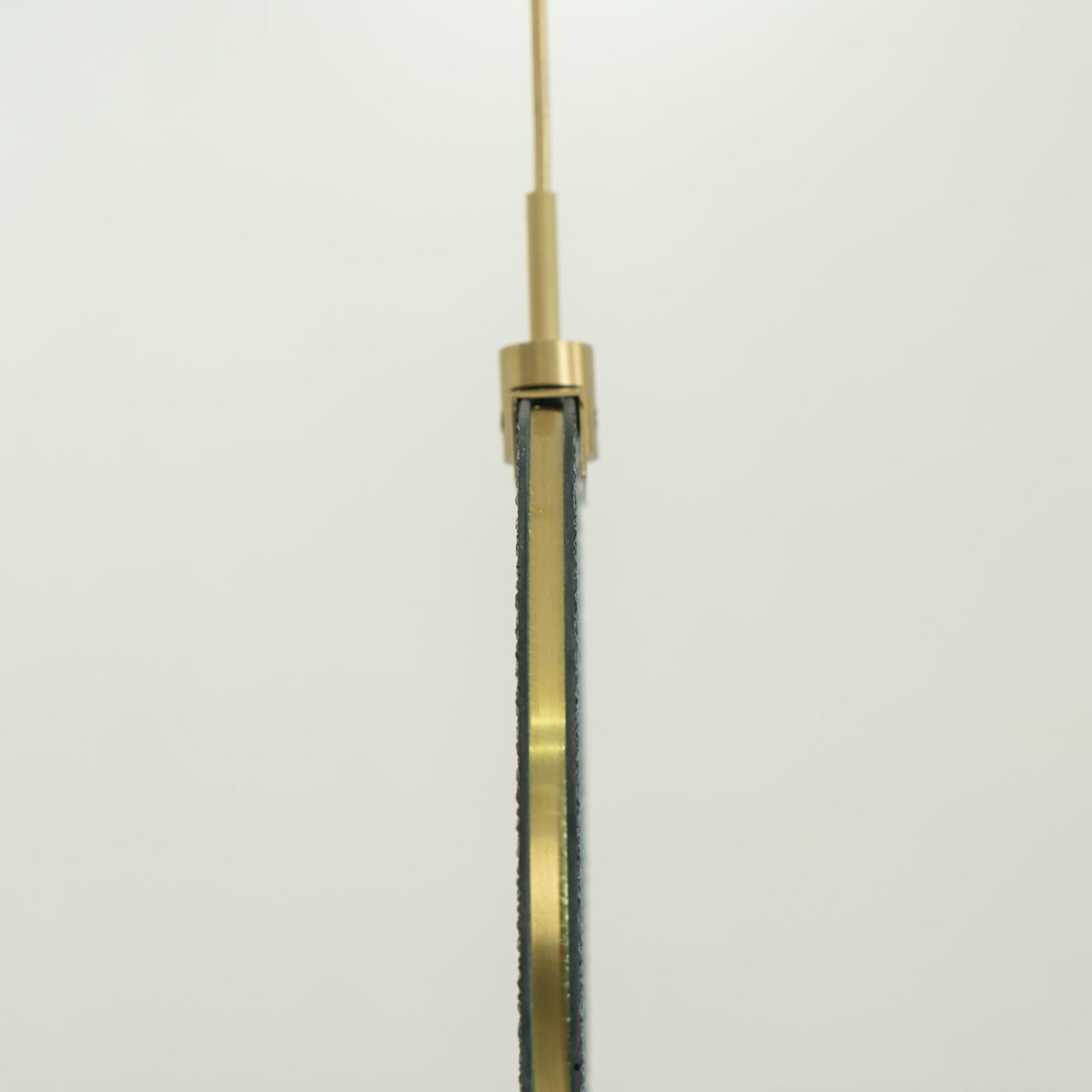 modern-circular-glass-pendant-light-with-brass-finish-and-integrated-led-spotlight