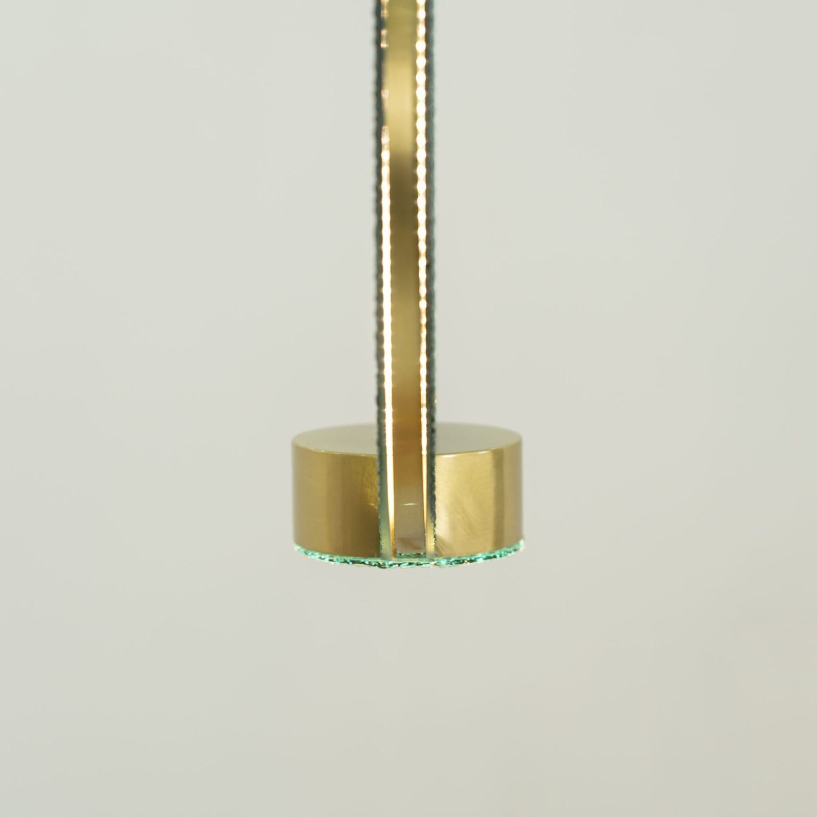 modern-circular-glass-pendant-light-with-brass-finish-and-integrated-led-spotlight