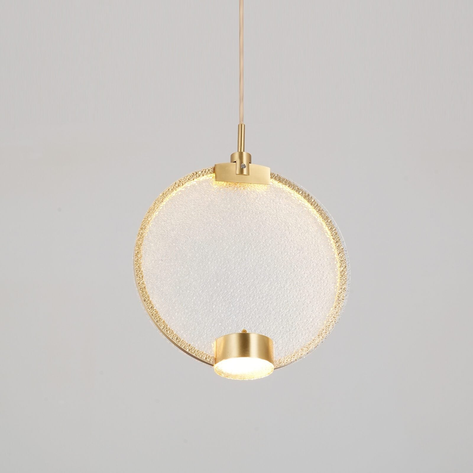 modern-circular-glass-pendant-light-with-brass-finish-and-integrated-led-spotlight