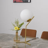 modern-opalescent-blown-glass-globe-table-lamp-with-flexible-steel-base-and-gold-finish