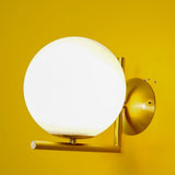 modern-opal-blown-glass-wall-sconce-with-elegant-brass-finish-round-globe-lighting