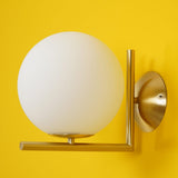 modern-opal-blown-glass-wall-sconce-with-elegant-brass-finish-round-globe-lighting