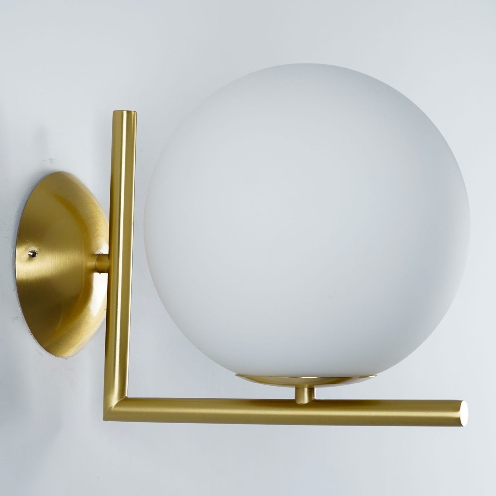 modern-opal-blown-glass-wall-sconce-with-elegant-brass-finish-round-globe-lighting