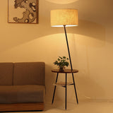 modern-inclined-wood-floor-lamp-with-fabric-shade-and-integrated-side-table